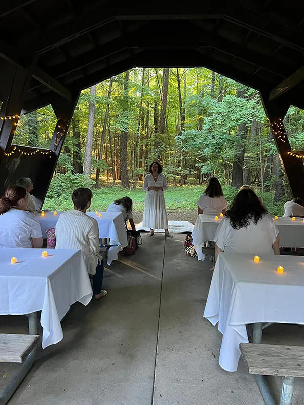 woman smiling while standing in garden