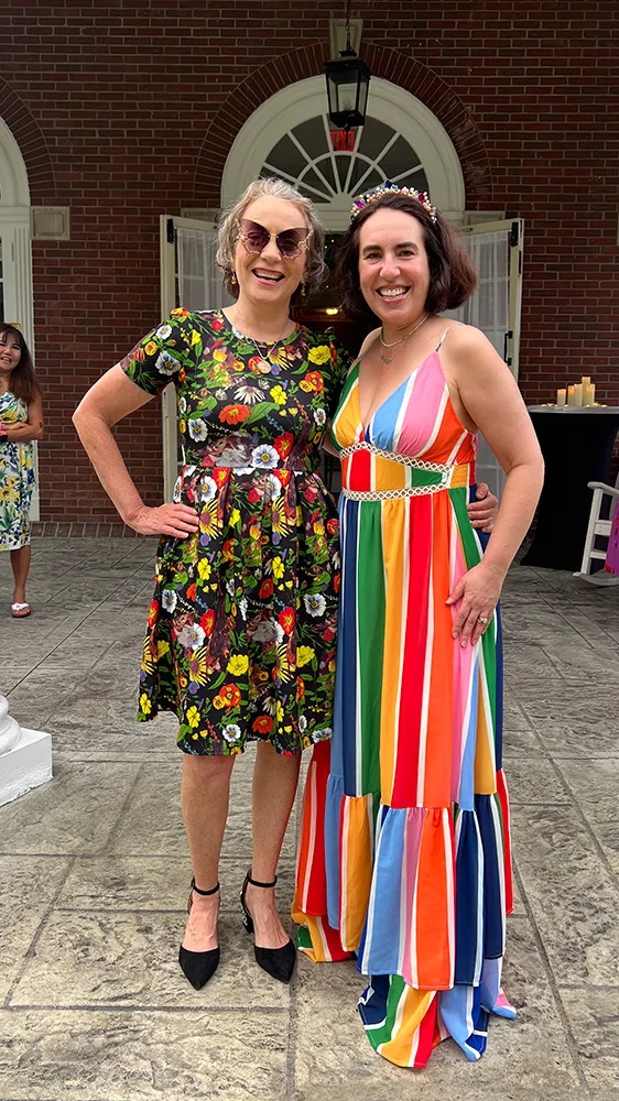 woman smiling while standing in garden
